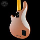 Electric guitar with a metallic finish on a black background, featuring the Tone Shop logo.