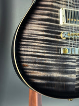 Front angle of Used 2024 PRS McCarty 594 10 Top Charcoal Burst.