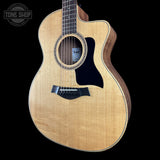 Taylor 114ce Studio Prototype Sapele/Spruce acoustic guitar on a black background with 'Tone Shop' logo.