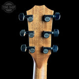 Back of headstock against a black background of Taylor 112ce Studio Prototype