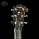 Taylor 314ce Prototype Next Generation guitar headstock on a black background