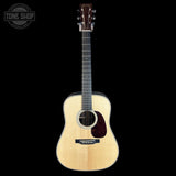 Acoustic guitar on a black background with 'Tone Shop' logo.