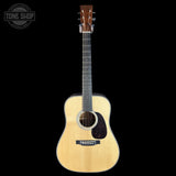 Acoustic guitar on a black background with 'Tone Shop' logo.