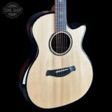 Taylor Builder's Edition 914ce Prototype Next Generation Acoustic guitar with a black pickguard on a black background, featuring the Tone Shop logo.