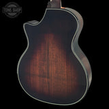 Close-up of Taylor Builder's Edition 514ce Prototype's back with a dark wood finish on a black background, featuring the Tone Shop logo.