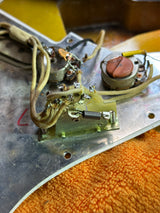 Electrical component with wires and connectors on a metal surface