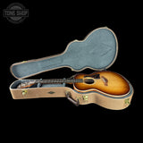 Taylor Gold Label 514e Prototype Sunburst Acoustic guitar in a hard-shell case with 'Tone Shop' logo.