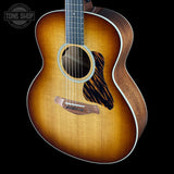 Taylor Gold Label 514e Prototype Sunburst Acoustic guitar with a sunburst finish on a black background, featuring the Taylor brand.