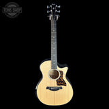 Taylor Builder's Edition 514ce Prototype Acoustic guitar with flame pattern on a black background, featuring the Taylor brand.