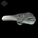 A dark gray guitar or bass gig bag with a yellow 'Tone Shop' logo on the front pocket, shown against a solid black background with a Tone Shop watermark in the top-left corner.