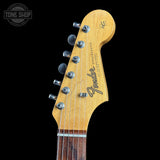 Fender guitar headstock with brand logo on a black background