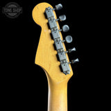 Guitar headstock with tuning pegs on a black background, featuring 'Tone Shop' logo.