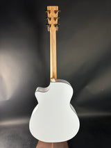 White electric guitar with wooden fretboard on a dark background