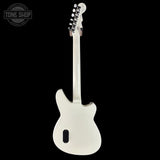 White electric guitar on a black background with 'Tone Shop' logo.