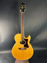 Acoustic guitar on a dark gray background