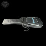 An Ibanez guitar gig bag in black and gray with a light blue logo, shown against a solid black background. A Tone Shop watermark is visible in the top-left corner.
