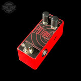 Red guitar effects pedal with 'Tone Shop' branding on a black background
