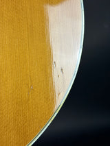 Aerial view of a large circular structure with a dark background