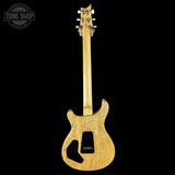 Wooden electric guitar on a black background with 'Tone Shop' logo.
