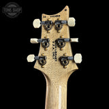 Guitar headstock with tuning pegs on a black background, featuring 'Tone Shop' logo.
