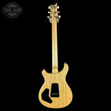 Wooden electric guitar on a black background with 'Tone Shop' logo.