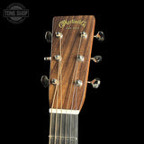 Guitar headstock with Martin & Co logo on a black background
