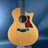 Acoustic guitar with a cutaway design on a blue background