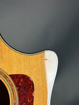 Close-up of a guitar's wooden soundboard on a dark background