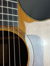 Close-up of an acoustic guitar's soundhole and strings