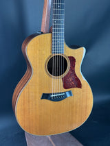 Acoustic guitar with a dark blue background