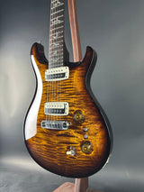 Electric guitar with a sunburst finish on a gray background