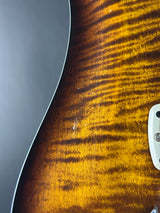 Close-up of a guitar's body with a sunburst finish