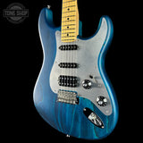 Blue electric guitar with a black background