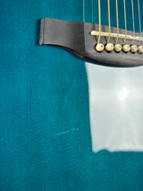 Scratch below bridge of Used PRS A60E Angelus Blue.