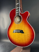 Acoustic guitar with a sunburst finish on a dark background