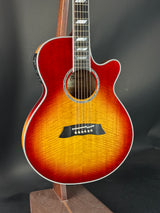 Acoustic guitar with a sunburst finish on a dark background