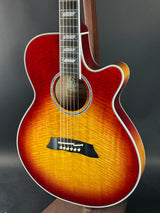 Acoustic guitar with a sunburst finish on a dark background