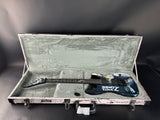 Guitar in a case with a dark background