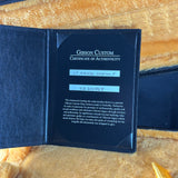 Gibson Custom Certificate of Authenticity on a wooden surface