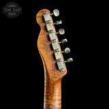 Close-up of the headstock of a guitar with a curved maple wood neck, six silver tuning pegs, and a black background. A Tone Shop watermark is visible in the top left corner.