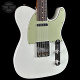 A white electric guitar with a light sage green pickguard, shown against a solid black background. The brand 'Floyd Rose' is visible on the tremolo system, and a 'Tone Shop' store watermark is in the top-left corner.