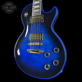Blue electric guitar with a black background