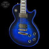Blue electric guitar with a black background