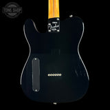 The back of a Fender Telecaster electric guitar in glossy black, featuring a maple neck, black pickguard, and chrome hardware against a black background.