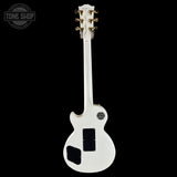 White electric guitar with a 'Tone Shop' logo in the corner