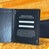 Gibson Custom Certificate of Authenticity on a textured surface