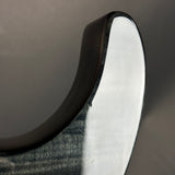Close-up of a black and white shoe sole on a gray background
