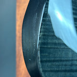 Close-up of a car tire with visible tread and rim