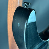 Close-up of a guitar's headstock with tuning pegs