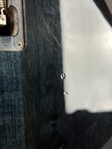 Close-up of a typewriter with visible wear and tear on the paper and carriage.